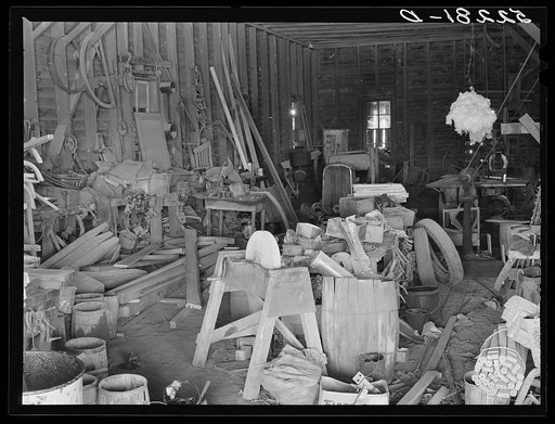 The blacksmith and carpentry shop on Marcella Plantation, Mileston, Mississippi Delta. At the right is a piece of cotton hanging up which Uncle George the blacksmith who has lived there fifty years keeps for good luck. Mississippi
