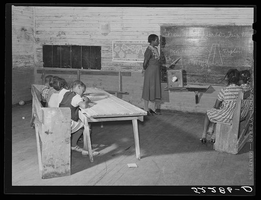 Interior of school on Mileston Plantation. School begins very late in the year and the attendance is poor until December because the children pick cotton. Mileston, Mississippi Delta, Mississippi