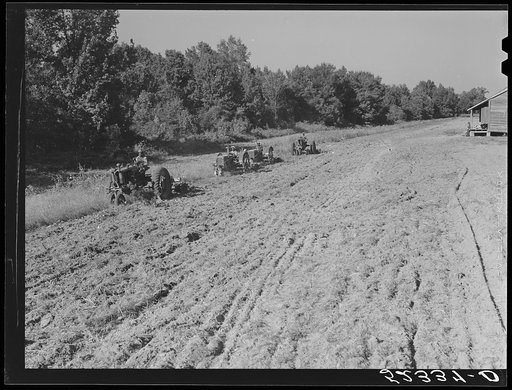 Untitled photo, possibly related to: Tractors preparing land for planting oats in the fall after the cotton has been picked and the stalks plowed. Good Hope Plantation, Mileston, Mississippi
