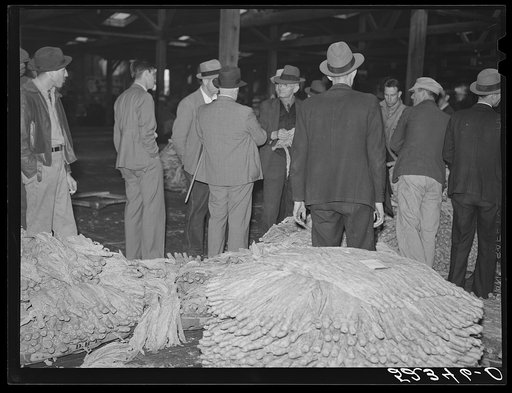 Untitled photo, possibly related to: Auction sale in tobacco warehouse. Durham, North Carolina