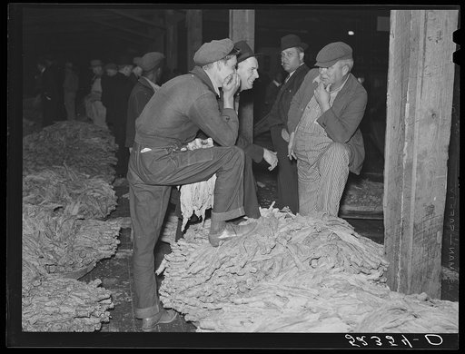 Farmers waiting around at tobacco auction. Durham, North Carolina