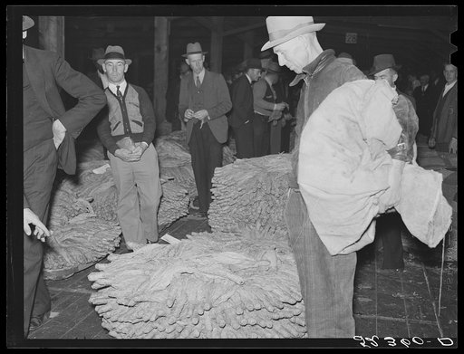 Untitled photo, possibly related to: Farmers waiting around at tobacco auction. Durham, North Carolina