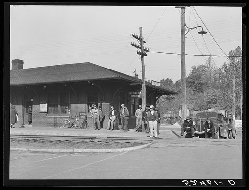 Men hanging around station in Newport, Tennessee