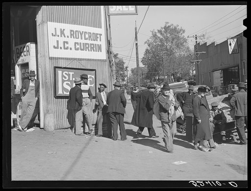 Outside tobacco warehouse during auction sales. Durham, North Carolina