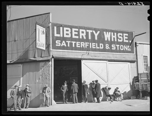 Outside tobacco warehouse during auction sale. Durham, North Carolina
