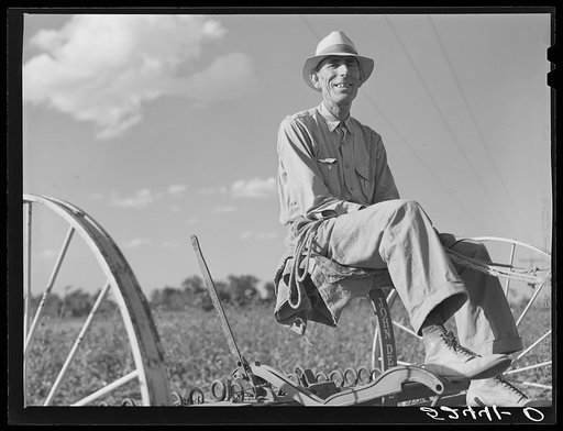 Tenant purchase client Mr. Crowell on his new hay rake. Mississippi Delta