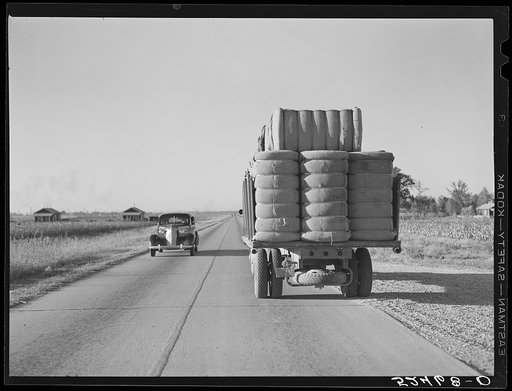 Untitled photo, possibly related to: Truck with bales of cotton from Hopson Planting Company gin going up highway to warehouse near Clarksdale, Mississippi Delta