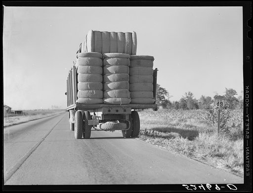 Untitled photo, possibly related to: Truck with bales of cotton from Hopson Planting Company gin going up highway to warehouse near Clarksdale, Mississippi Delta