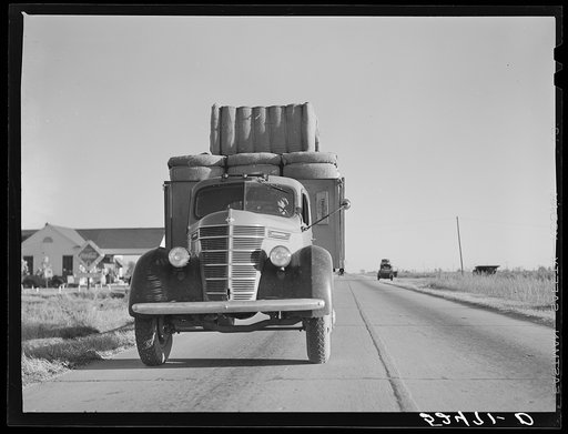 Truck with bales of cotton from Hopson Planting Company gin going up highway to warehouse near Clarksdale, Mississippi Delta