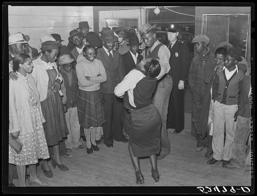 Negroes jitterbugging in a juke joint on Saturday afternoon. Clarksdale, Mississippi Delta