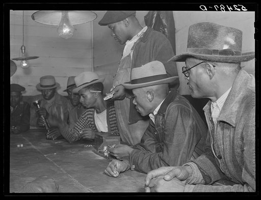 Negroes gambling with their cotton money in a juke joint outside of Clarksdale, Mississippi Delta
