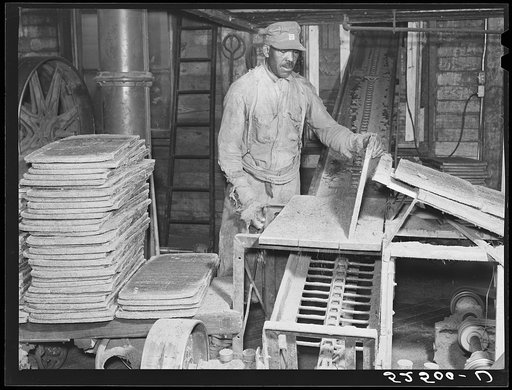 Untitled photo, possibly related to: Cakes of cottonseed meal which is fed to cattle in oil plant. Clarksdale, Mississippi Delta
