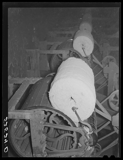 Untitled photo, possibly related to: Rolls of lint from the cottonseed used in making of ammunitions and various cellulose products. Oil plant, Clarksdale, Mississippi Delta