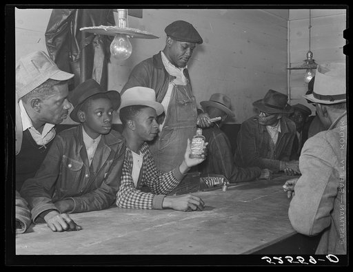 Negroes spending their cotton money in gambling in juke joint. Saturday night, outside Clarksdale, Mississippi Delta