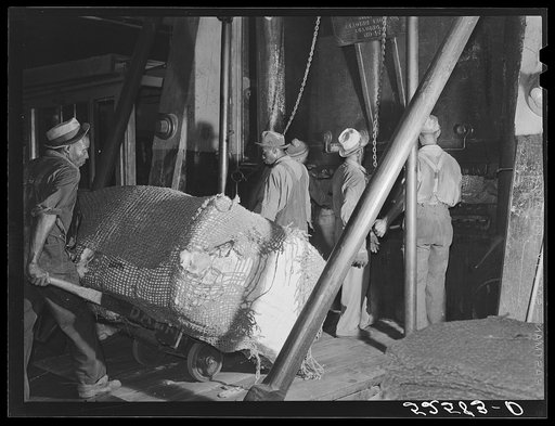 Bale of cotton going into the compress. Memphis, Tennessee