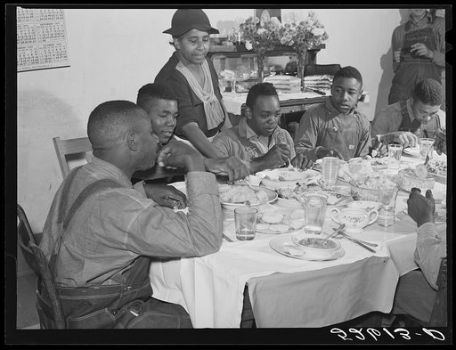 Untitled photo, possibly related to: The Negro tenants and neighbors eating dinner after the white men have finished on day of corn-shucking at Mrs. Fred Wilkins' home. Tallyho, Stem, Granville County, North Carolina