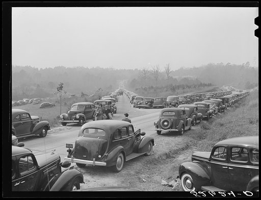 Untitled photo, possibly related to: Lines of cars along highways on day at Duke-Carolina football game. Durham, near Duke University Stadium. Durham County, North Carolina