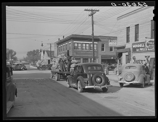 Truckload of tobacco in baskets being taken from the warehouse after the auction sales down the main street of Wendell, North Carolina, Wake County