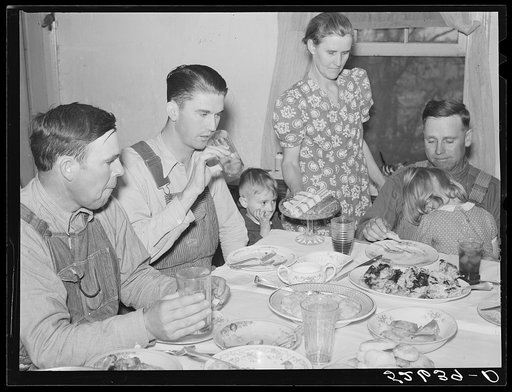 Mrs. Fred Wilkins passing cake to the men at dinner on corn-shucking day. Tallyho, Stem, Granville County, North Carolina
