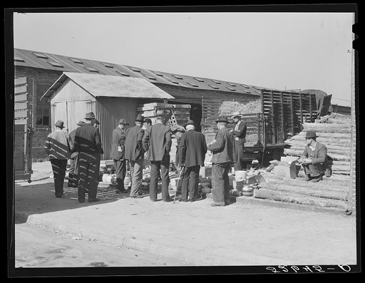 Farmers buying china from salesman outside tobacco warehouse during auction sales. Wendell, North Carolina