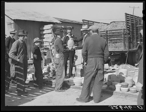 Untitled photo, possibly related to: Farmers buying china from salesman outside tobacco warehouse during auction sales. Wendell, North Carolina