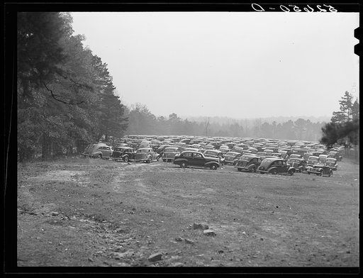 Untitled photo, possibly related to: Cars parked in field near Duke University Stadium on day of Duke-Carolina football game. Durham, North Carolina