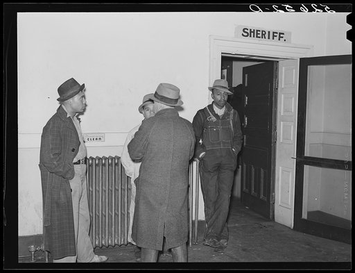 Negroes waiting outside sheriff's office in county courthouse. Oxford, Granville County, North Carolina