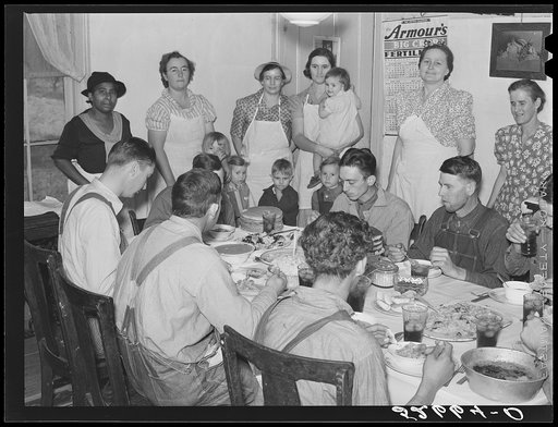 Untitled photo, possibly related to: Some of the Wilkins clan at dinner on corn-shucking day at home of Mrs. Fred Wilkins. Tallyho, near Stem, Granville County, North Carolina