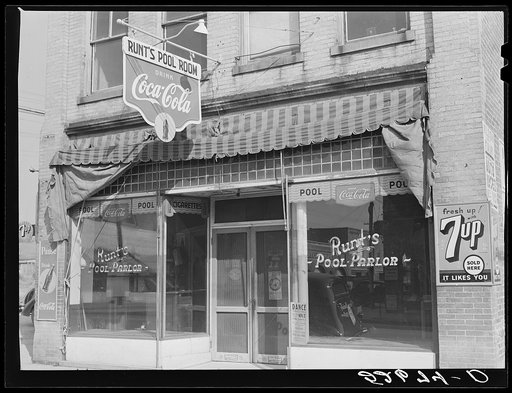 Runt's pool parlor with poster advertising a tobacco ball in window. Zebulon, Wake county, North Carolina