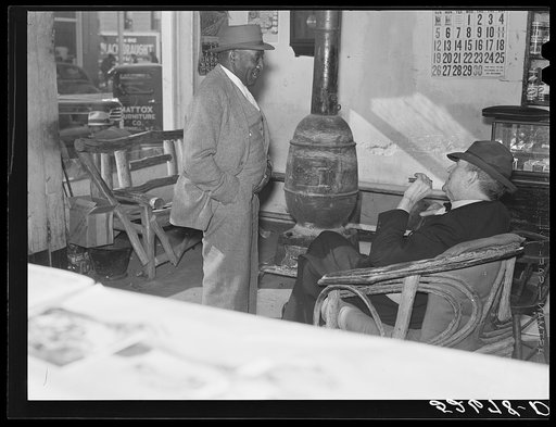 Interior of Whitley general store. A Negro who is president of an industrial school is trying to get a donation for its support from Mr. R.B. Whitley. He is president of the bank, owner of very large store, practically owns and runs the town. He is a big landowner, owns Whitley-Davis farm and a cott