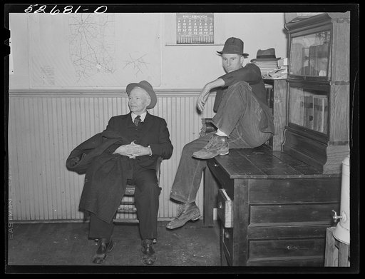 Untitled photo, possibly related to: Group of men killing time during dinner hour in sheriff's office. Granville County Courthouse on court day in county seat. Oxford, North Carolina