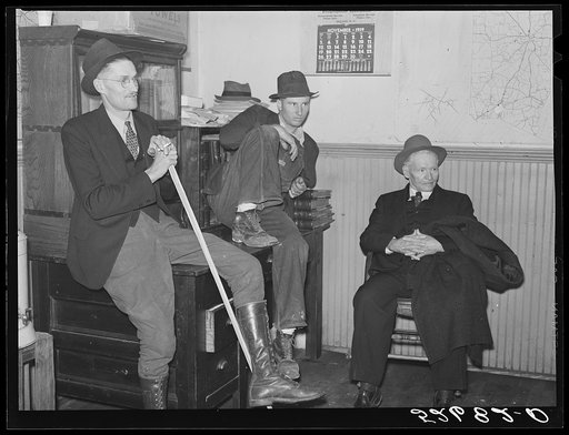 Group of men killing time during dinner hour in sheriff's office. Granville County Courthouse on court day in county seat. Oxford, North Carolina