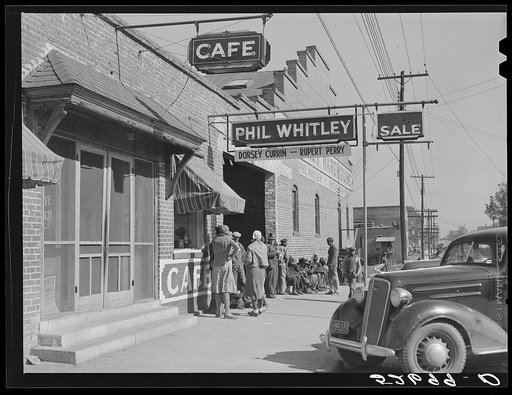 Negroes waiting to go to work at one o'clock in warehouse and tobacco stem factory. Wendell, Wake County, North Carolina