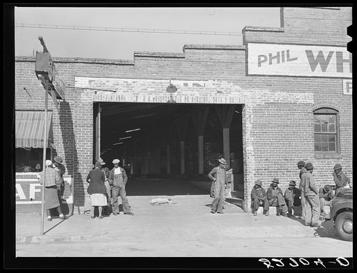 Negroes waiting to go to work at one o'clock in warehouse and tobacco stem factory, Wendell, Wake County, North Carolina