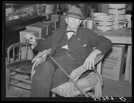 Mr. R.B. Whitley visiting in his general store. He is president of the bank and owns and runs practically all of the town, he is a big landowner, owns Whitley-Davis Farm and a cotton mill in Clayton. He said he cut down the trees and pulled the stumps out of the main street and was the first man in 