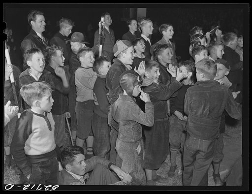 Children at pep rally cheering for Kay Kyser at North Carolina University. Chapel Hill, Orange County, North Carolina