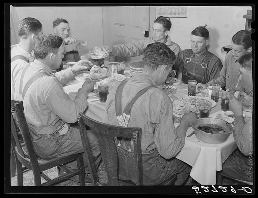Men of the Wilkins clan eating dinner on cornshucking day at home of Mrs. Fred Wilkins. Tallyho, near Stem, Granville County, North Carolina