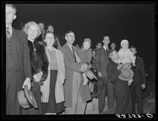 Some University of North Carolina students on their campus in Chapel Hill, Orange County, North Carolina, with their weekend guests and many of the townspeople at a pep rally the night before the Duke-North Carolina game which was played in the Duke Stadium in Durham, North Carolina