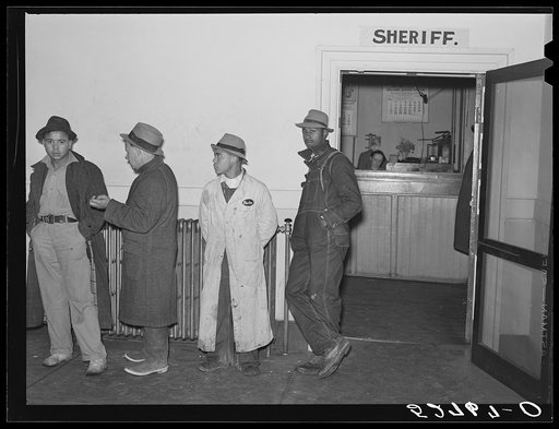 Untitled photo, possibly related to: Men killing time in sheriff's office on court day, during dinner hour. Granville County County Courthouse, Oxford, North Carolina. See subregional notes (Odum) November 22, 1939