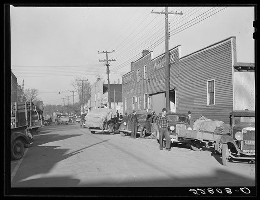 Untitled photo, possibly related to: Farmer taking his tobacco from one warehouse to another for auction sale. Most of the warehouses are very rushed and quickly filled up the first of the week because most farmers think they get a better price on Monday and Tuesday. Mebane, Orange County, North Car