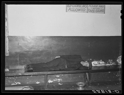 Untitled photo, possibly related to: Farmers must often wait overnight or for several days before their tobacco is sold at auction. They sometimes hang around in cafes or pool rooms, sleeping most anywheres. Durham, North Carolina