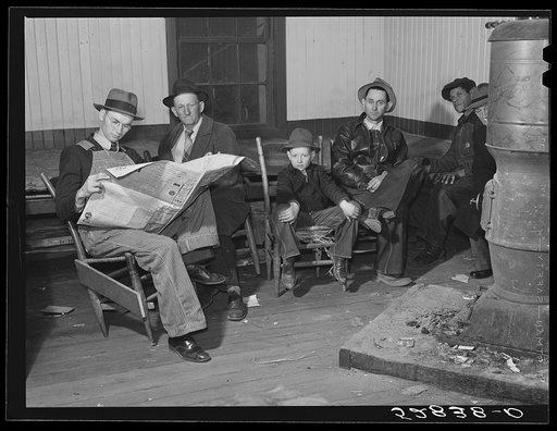Farmers waiting around in camp room on morning of tobacco auction sale. Mebane, Orange County, North Carolina