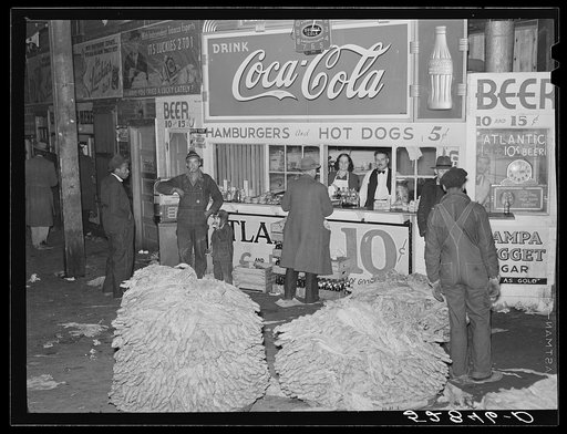 Lunch stand and tobacco inside entrance to warehouse at end of auction sale. Durham, North Carolina