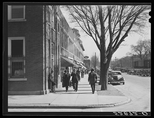 Main street on day of tobacco auctions in Mebane, North Carolina.  This is a small town about [...] with [...] tobacco warehouses and [...] sets of buyers. Orange County