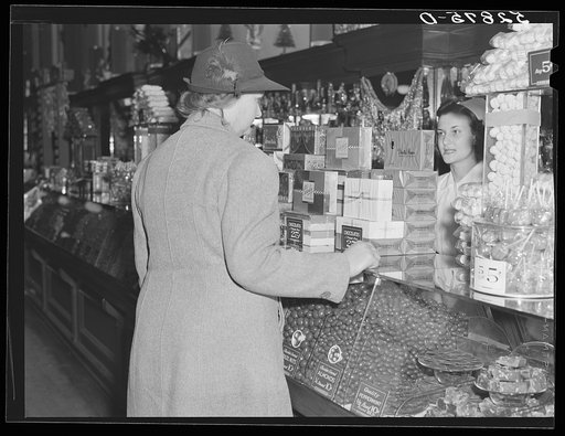 Untitled photo, possibly related to: Mrs. Elvin Wilkins (Rosa) buying candy to send away to her daughter at school. She came to Durham with her husband this day to sell their tobacco at auction and do some general shopping. Durham, North Carolina