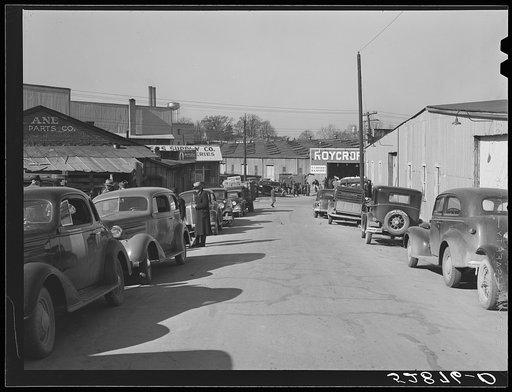 Street in warehouse district during tobacco auction sales. Durham, North Carolina