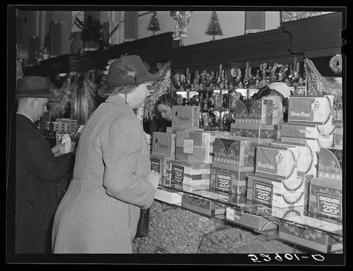 Mrs. Elvin Wilkins (Rosa) buying candy to send away to her daughter at school. She came to Durham with her husband this day to sell their tobacco at auction and do some general shopping. Durham, North Carolina