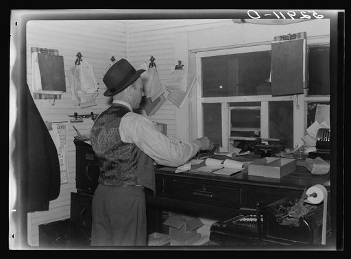 Untitled photo, possibly related to: Business managers of plantations paying off cotton pickers on Saturday in plantation store. Mileston, Mississippi Delta