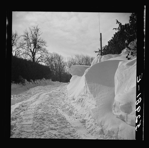 Snow drifts and driveway along main highway near Rockville, Maryland. Montgomery County, Maryland