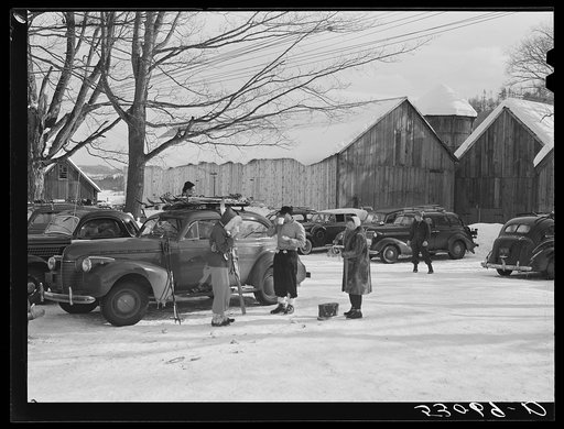 Untitled photo, possibly related to: Every available space for parking is used by skiers on weekends at Clinton Gilbert's farm. The house is about eight years old; purchased by Gilbert in 1929. He has about 150 acres, mainly a dairy farm with twenty three cows. He also makes about one hundred gallon